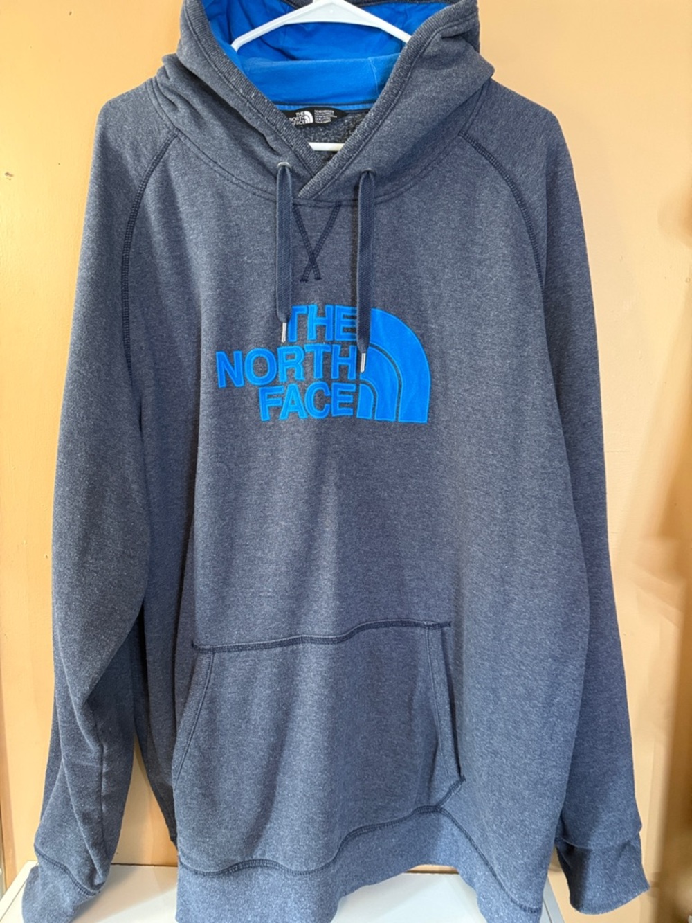 The North Face Men's Charcoal Gray Hoodie with Bright Blue Logo